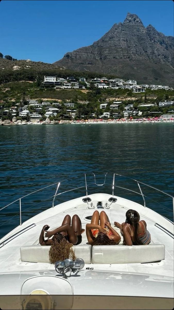Women relaxing on a boat with an ocean view